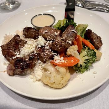 M's Pub signature dishes Lamb BurgerIndian Lamb SatayCarrot Dog